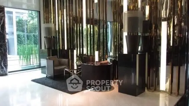 Luxurious modern lobby with sleek decor and elegant seating area.