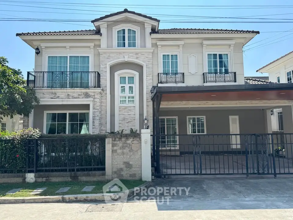 Elegant two-story house with modern design and spacious driveway in a serene neighborhood.