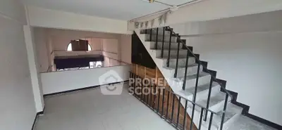 Spacious interior with staircase and open layout, ideal for creative renovations.