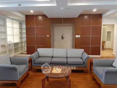 Spacious living room with elegant wooden flooring and modern furniture