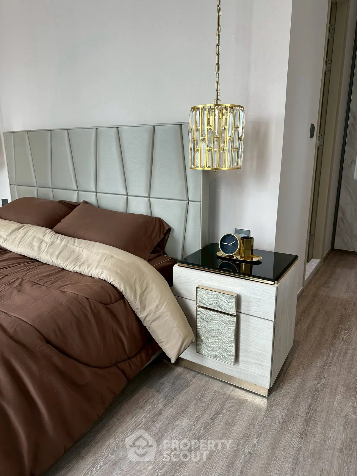 Luxurious bedroom with elegant decor and modern lighting