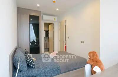 Modern bedroom with cozy decor and ample natural light