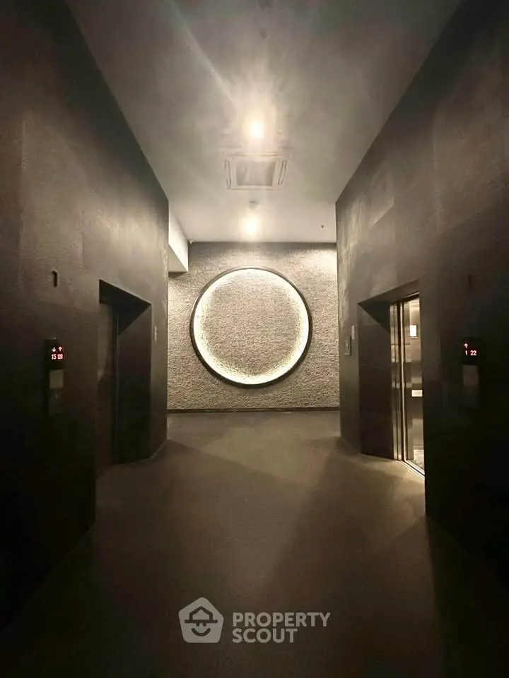 Luxurious modern elevator lobby with ambient lighting and sleek design.