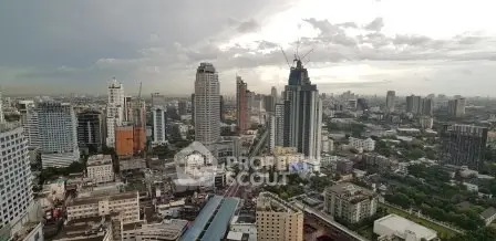 Stunning cityscape view showcasing modern skyscrapers and urban skyline under a dramatic sky.