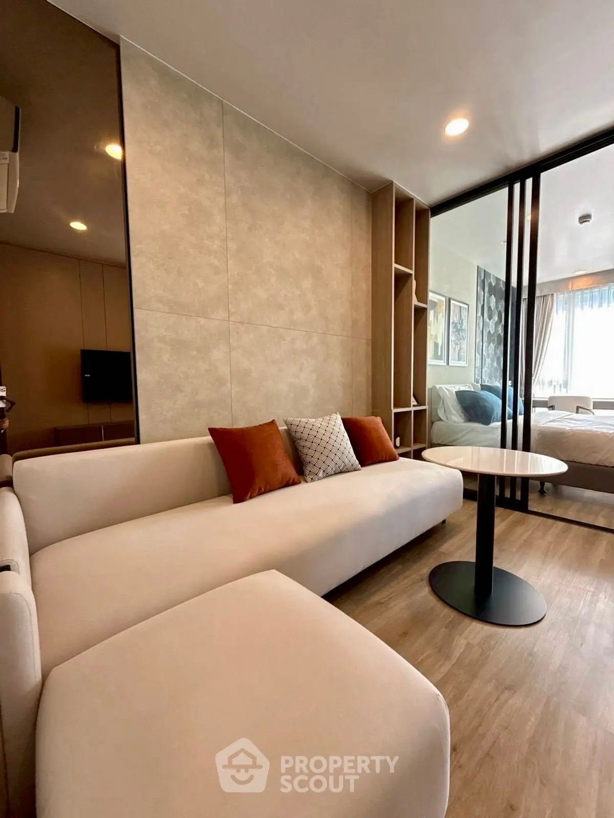 Modern living room with elegant decor and natural light in a stylish apartment.