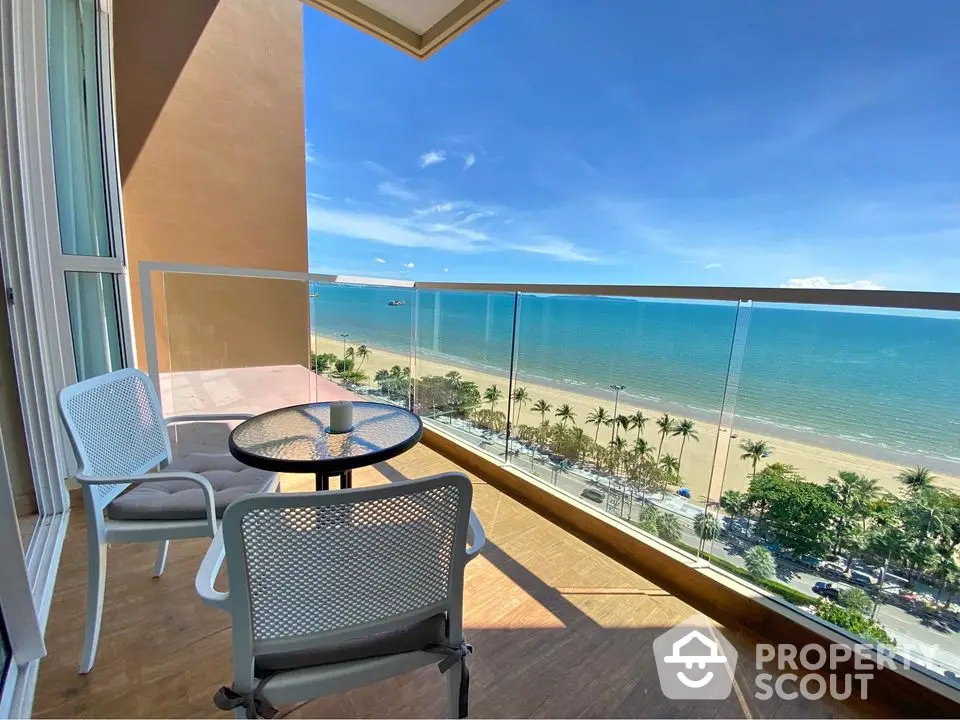 Stunning beachfront balcony with panoramic ocean views and modern outdoor seating.