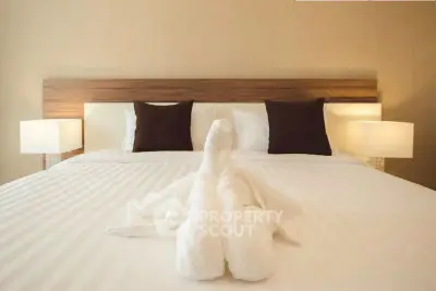 Luxurious bedroom with elegant decor and plush bedding, perfect for relaxation and comfort.