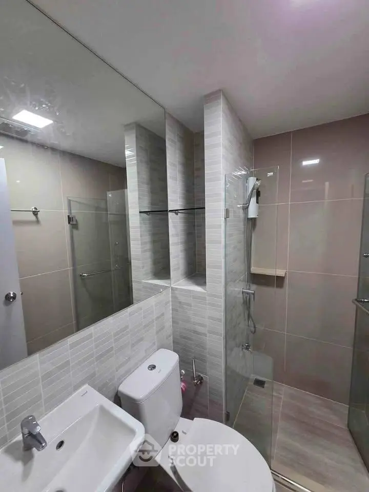 Modern bathroom with sleek design and glass shower enclosure