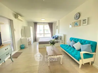 Spacious studio apartment with modern decor and natural light