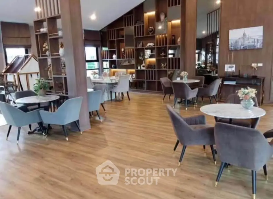 Luxurious modern common area with elegant seating and stylish decor in upscale building.