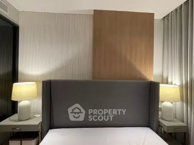 Modern bedroom with stylish headboard and ambient lighting