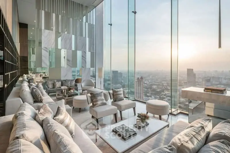 Luxurious high-rise living room with panoramic city views and elegant modern decor.