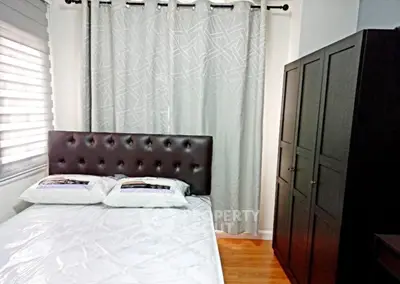 Cozy bedroom with modern decor and ample storage space