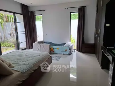 Spacious bedroom with garden view and modern decor