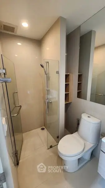 Modern bathroom with glass shower and sleek fixtures