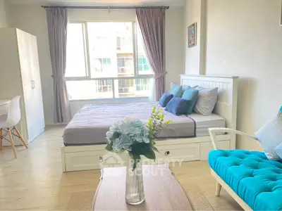 Bright and cozy bedroom with modern decor and large window view