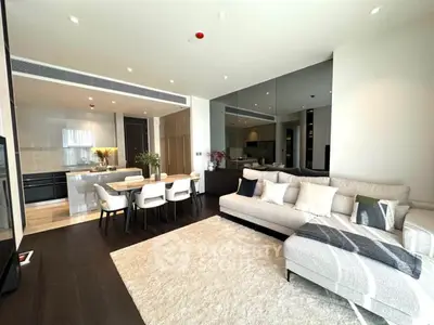 Luxurious open-plan living room with modern kitchen and elegant decor