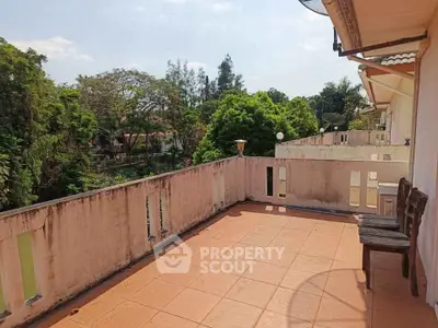 Spacious balcony with scenic views and ample seating, perfect for relaxation and outdoor enjoyment.