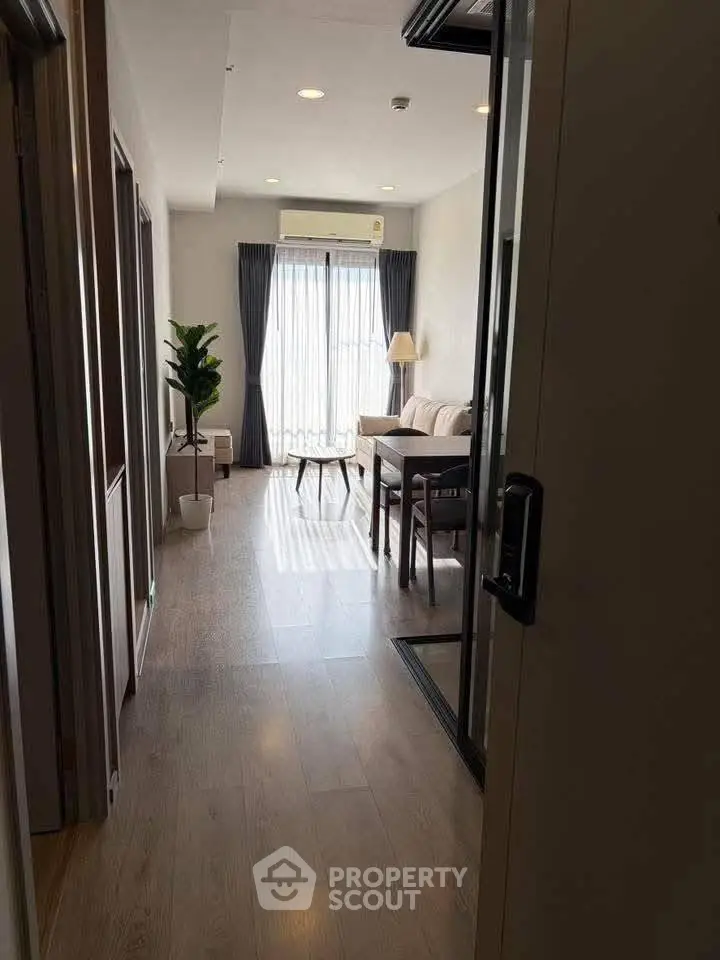 Modern living room with wooden flooring and natural light