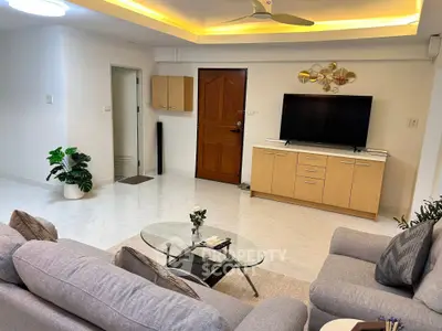 Spacious living room with modern decor and stylish furniture