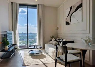 Modern living room with large window offering stunning city view, stylish furniture, and elegant decor.