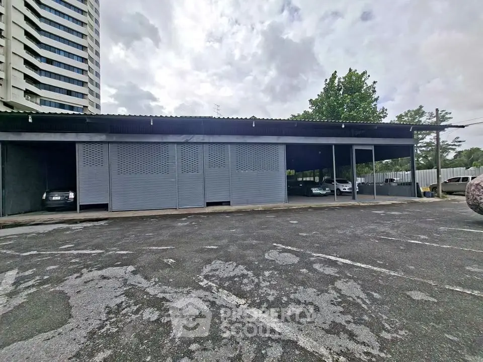 Spacious parking area with covered spaces in urban setting