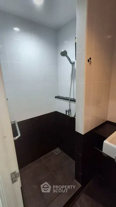 Modern bathroom with sleek shower and elegant tile design