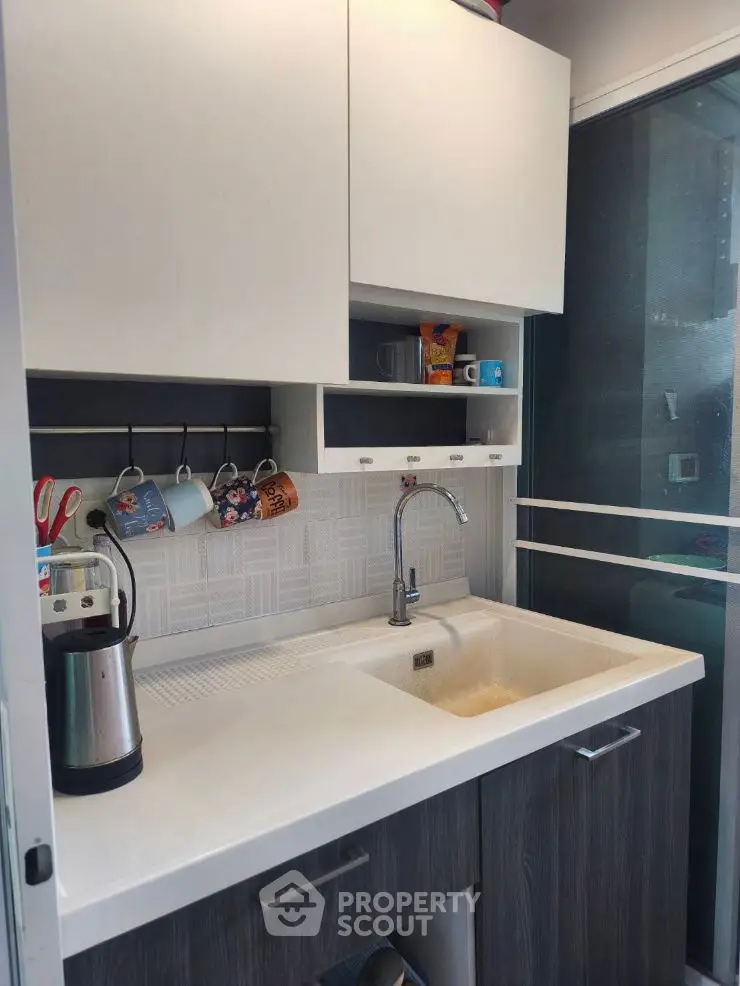 Modern kitchen with sleek cabinetry and stylish sink area