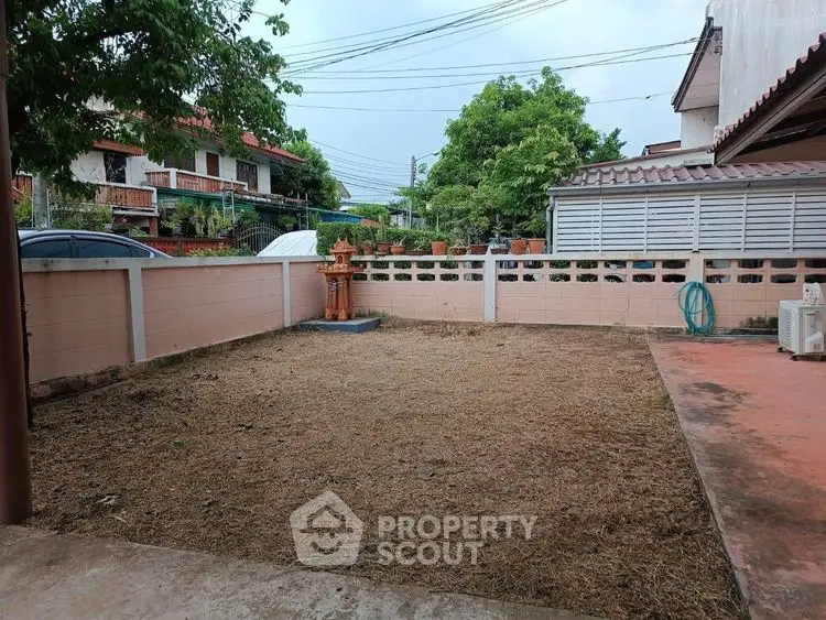 Spacious backyard with potential for landscaping in suburban neighborhood