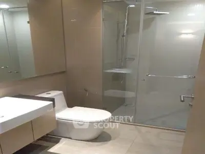 Modern bathroom with glass shower and sleek fixtures