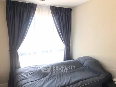 Cozy bedroom with elegant curtains and natural light