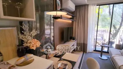 Stylish living room with elegant dining setup and balcony view