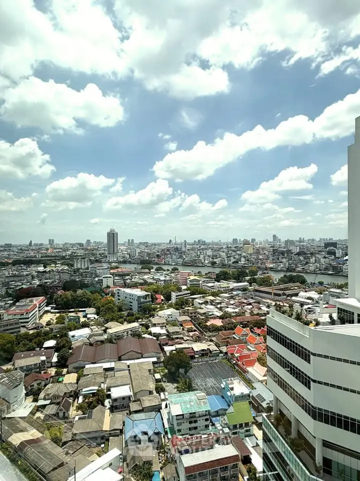 Stunning cityscape view from high-rise building showcasing urban skyline and vibrant neighborhood.
