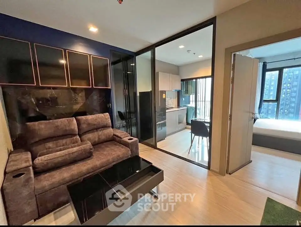 Modern condo interior with cozy living room, sleek kitchen, and bright bedroom, ideal for urban living.