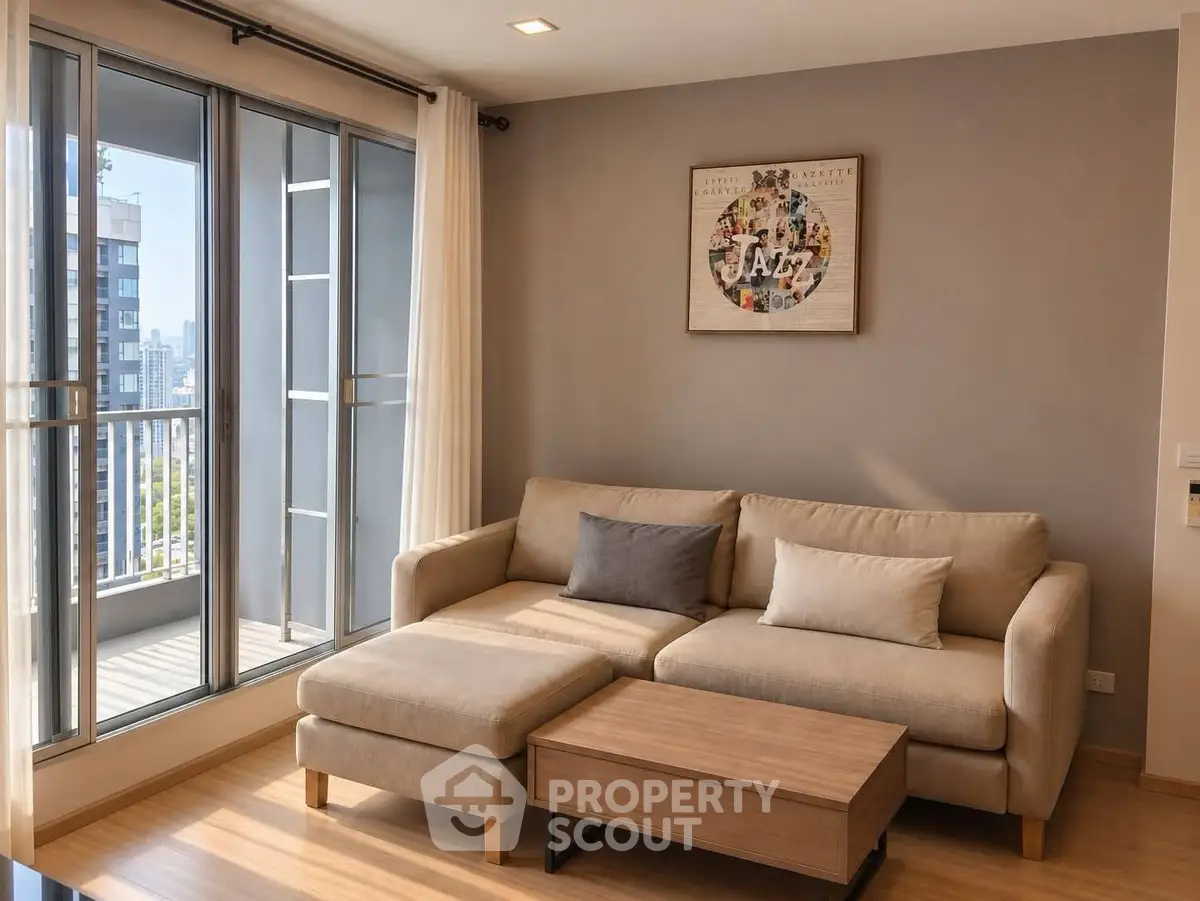 Modern living room with cozy sofa and large windows opening to a balcony with city view.