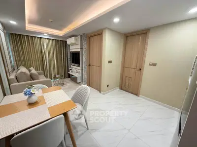 Modern living room with dining area, stylish decor, and ambient lighting in a cozy apartment.