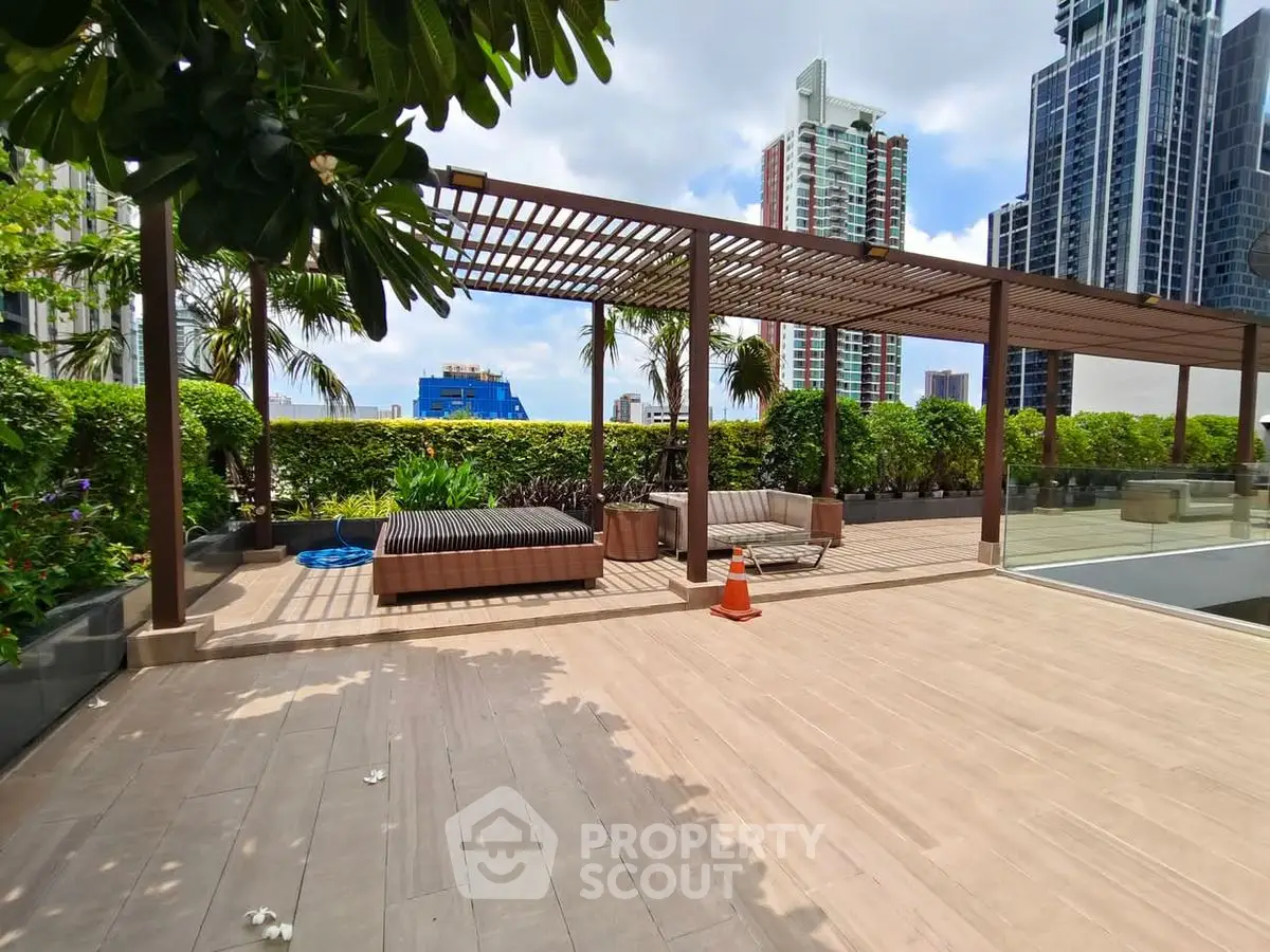 Luxurious rooftop terrace with modern pergola and city skyline view, perfect for relaxation and entertainment.