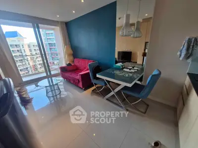 Modern living room with vibrant decor and city view from balcony