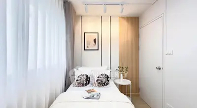 Cozy modern bedroom with stylish decor and natural light