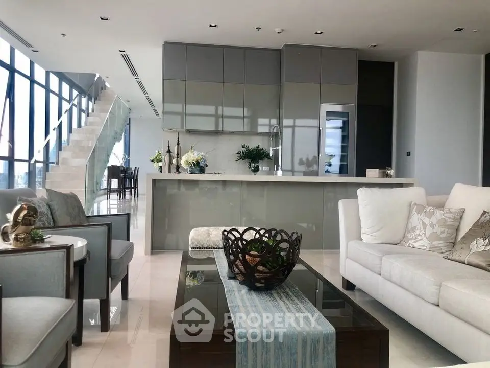 Luxurious modern living room with open kitchen and elegant decor