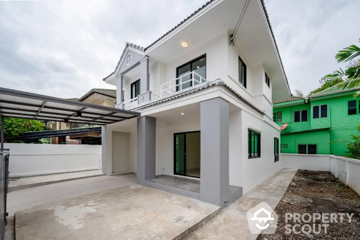 Modern two-story house with spacious driveway and contemporary design