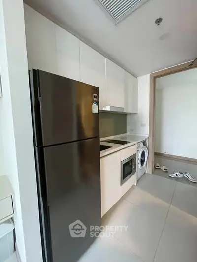 Modern kitchen with sleek appliances and minimalist design