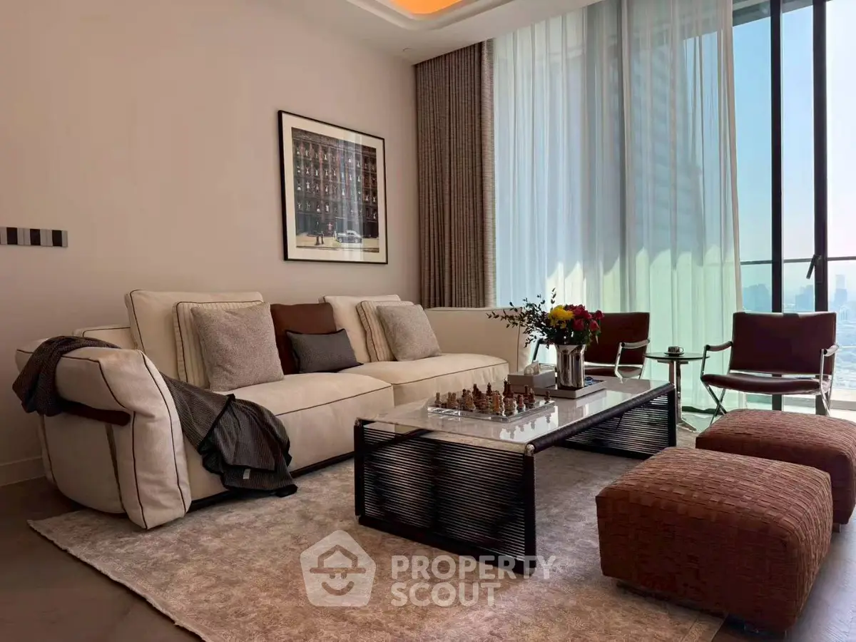 Luxurious living room with modern decor and city view, featuring elegant furniture and natural light.