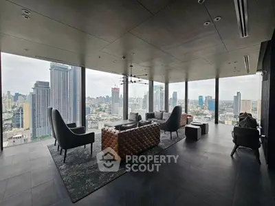 Luxurious high-rise living room with panoramic city views and modern furnishings.
