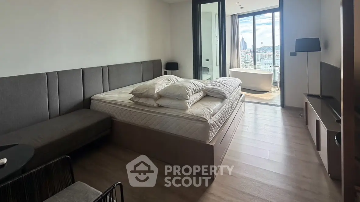 Luxurious bedroom with stunning city view and modern decor