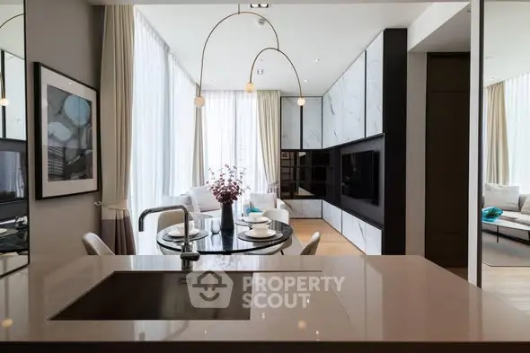 Luxurious modern living room with open kitchen and elegant decor