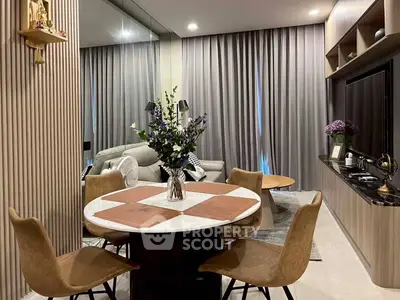 Modern living room with elegant dining area and stylish decor