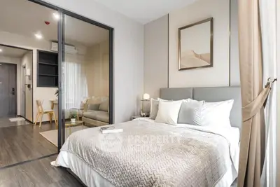 Modern bedroom with elegant decor and cozy ambiance in a stylish apartment.