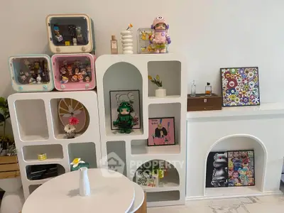 Stylish living room with modern shelving and decorative figurines, perfect for a trendy home ambiance.