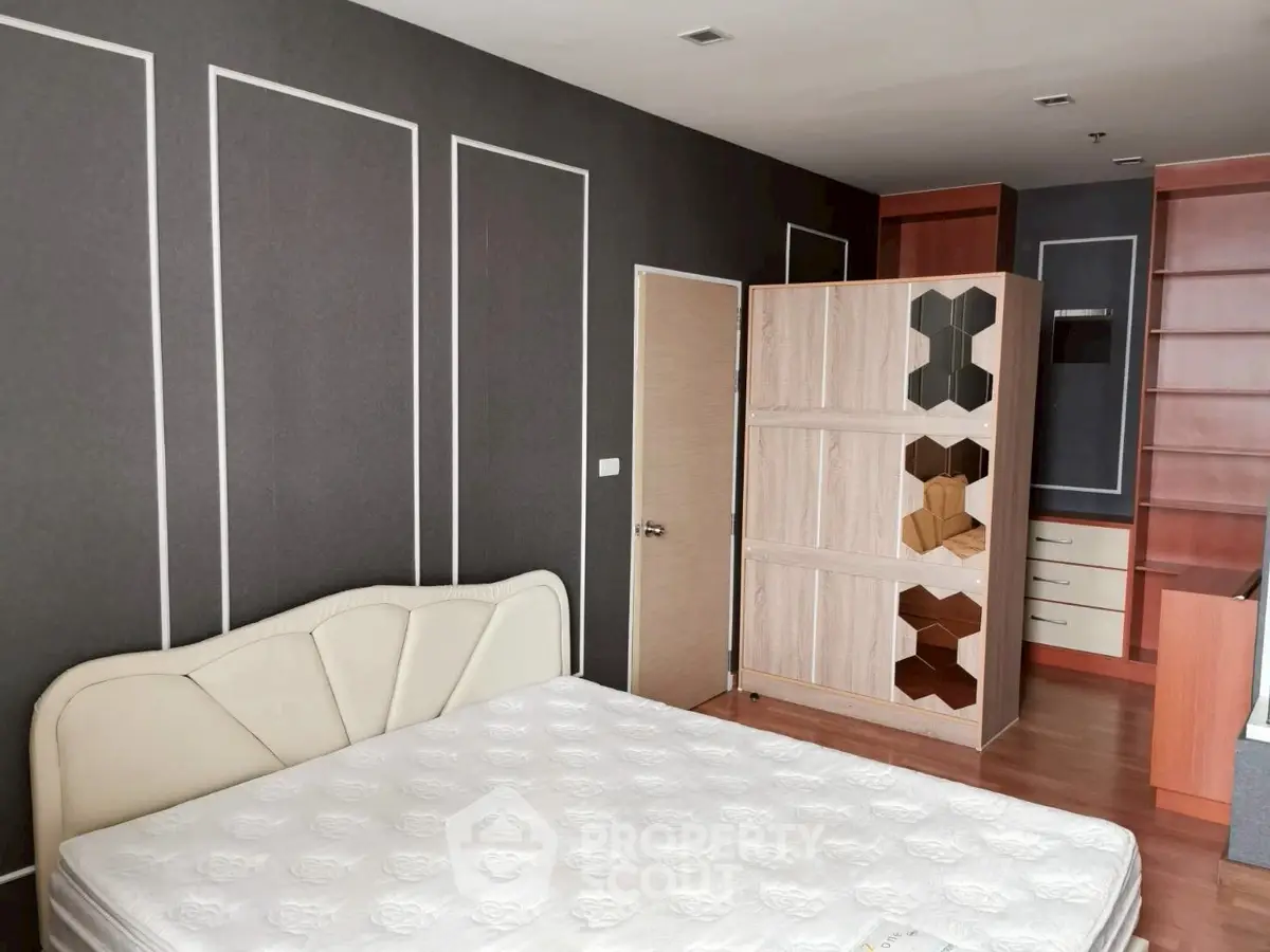 Spacious bedroom with modern design and ample storage space